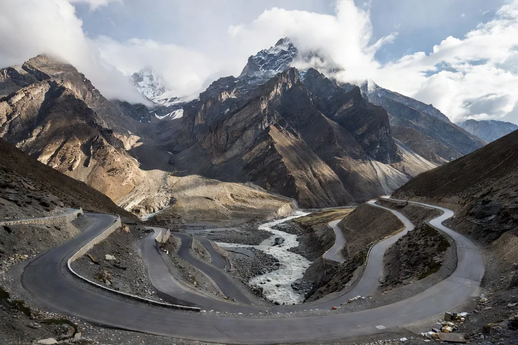 Winding mountain highway in the Karakoram foothills with a river below